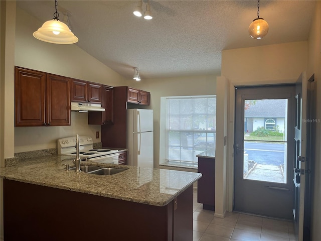 kitchen featuring light stone countertops, white appliances, lofted ceiling, decorative light fixtures, and kitchen peninsula