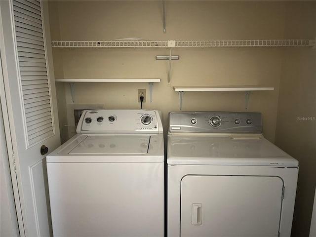 laundry area with washing machine and dryer