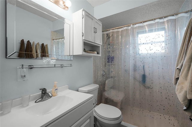 bathroom featuring toilet, a shower with shower curtain, and vanity