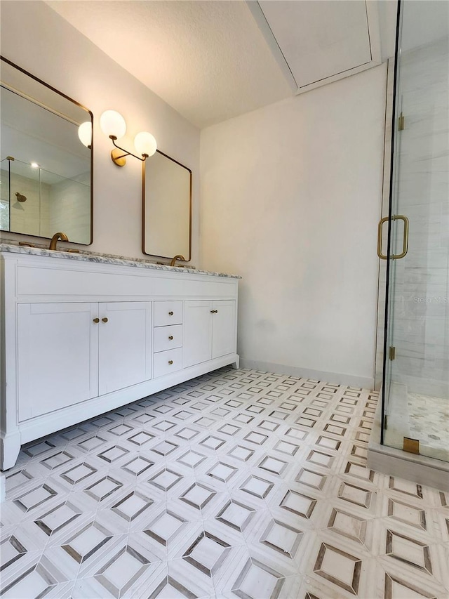 bathroom featuring an enclosed shower and vanity