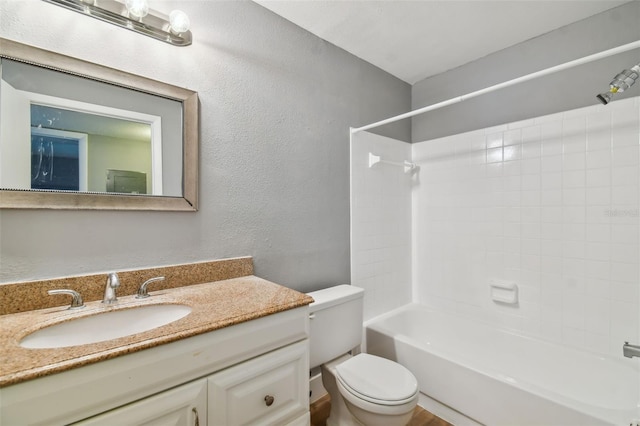 full bathroom with toilet, bathing tub / shower combination, and vanity