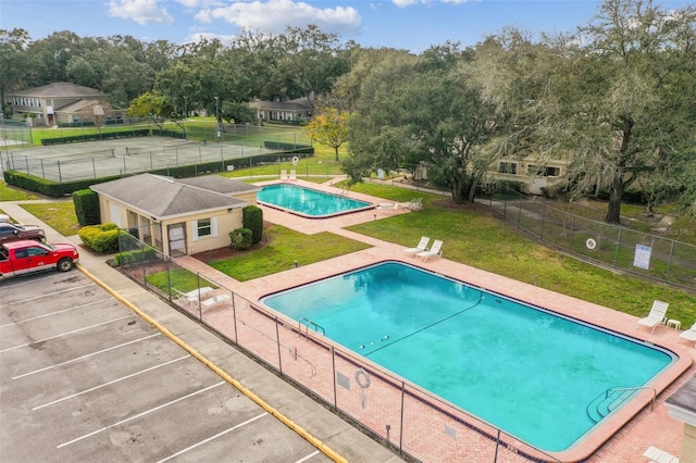 view of pool with a yard and a patio area