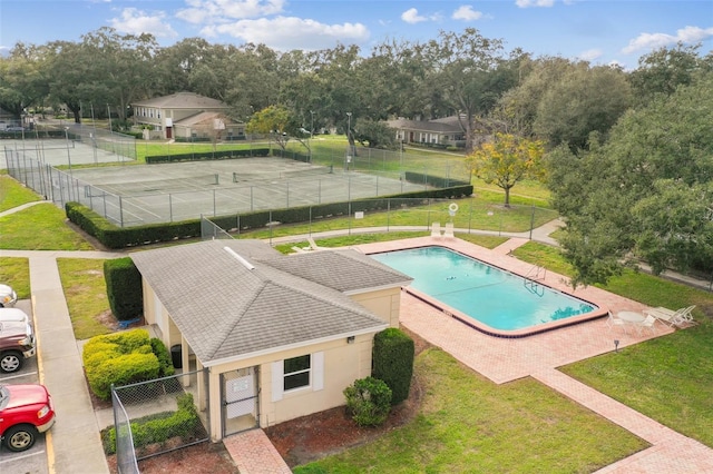 view of swimming pool featuring a patio area and a lawn