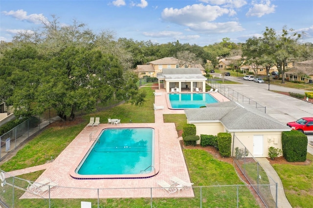 view of pool with a yard and a patio area