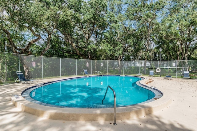 view of swimming pool with a patio