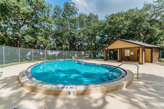 view of swimming pool with a patio