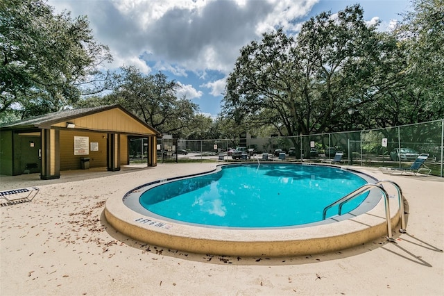 view of swimming pool with a patio area