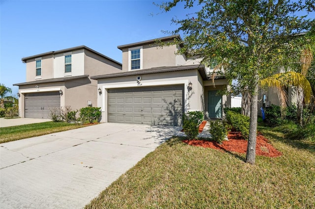 view of front of property featuring a front lawn and a garage