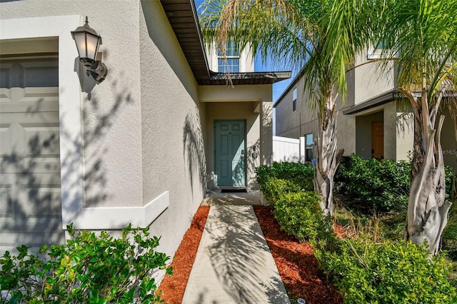 property entrance with a garage