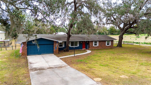 ranch-style house with a garage and a front yard