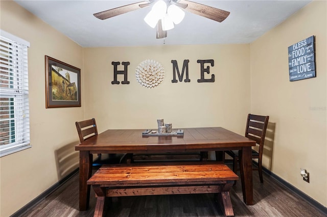 dining room featuring ceiling fan, baseboards, and wood finished floors