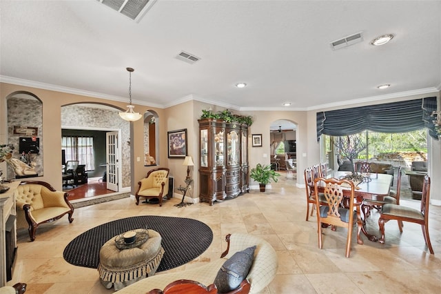 dining room featuring ornamental molding and a wealth of natural light