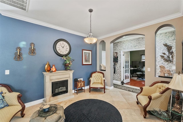 sitting room featuring ornamental molding and light tile patterned flooring