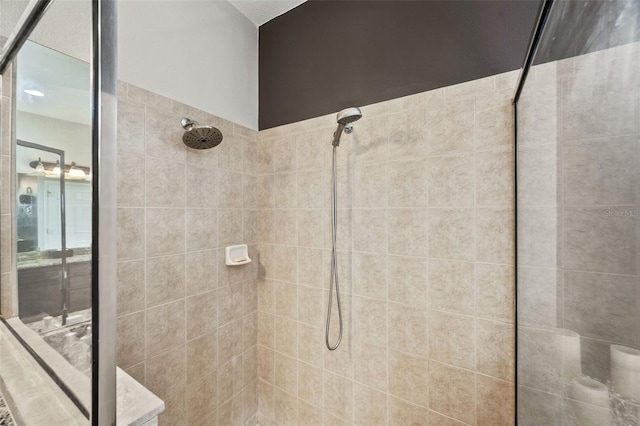 bathroom with tiled shower