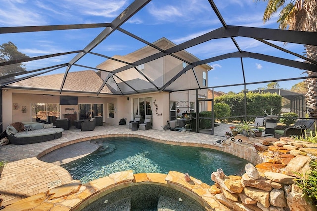 view of swimming pool featuring a patio, glass enclosure, an in ground hot tub, and outdoor lounge area