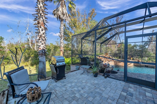 view of patio with a lanai and a grill