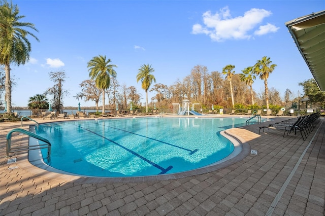 view of swimming pool with a patio area