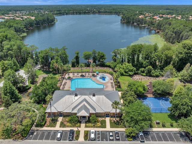 birds eye view of property with a water view