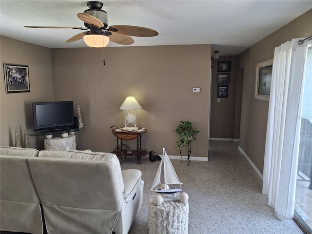 living room featuring ceiling fan