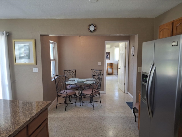 dining area with a textured ceiling