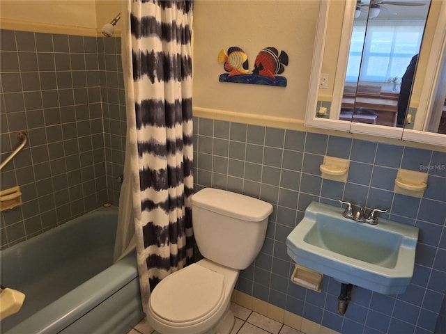 full bathroom with sink, tile walls, shower / bath combination with curtain, tile patterned flooring, and toilet