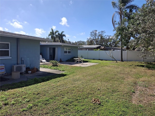 view of yard with ac unit and a patio area