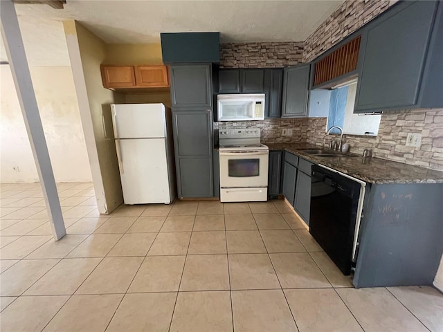 kitchen with white appliances, sink, decorative backsplash, and light tile patterned floors