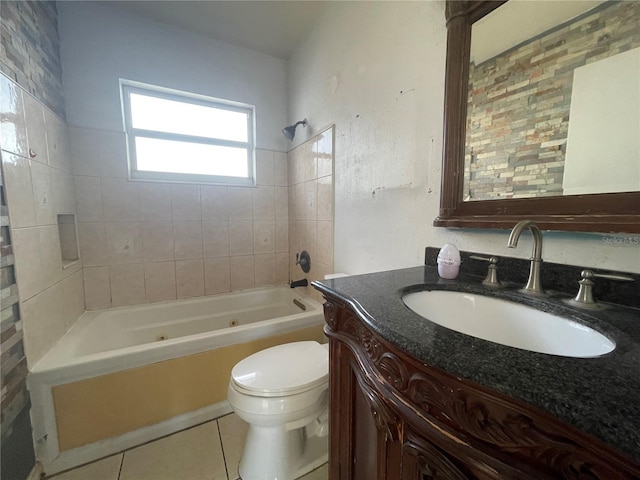 full bathroom with vanity, tile patterned flooring, toilet, and tiled shower / bath