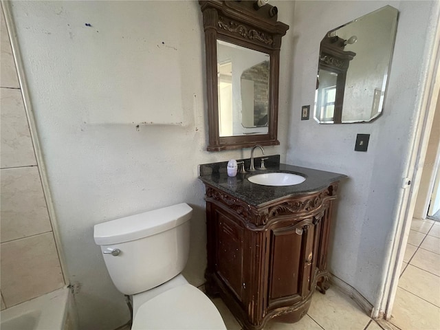 bathroom featuring vanity, toilet, and tile patterned flooring