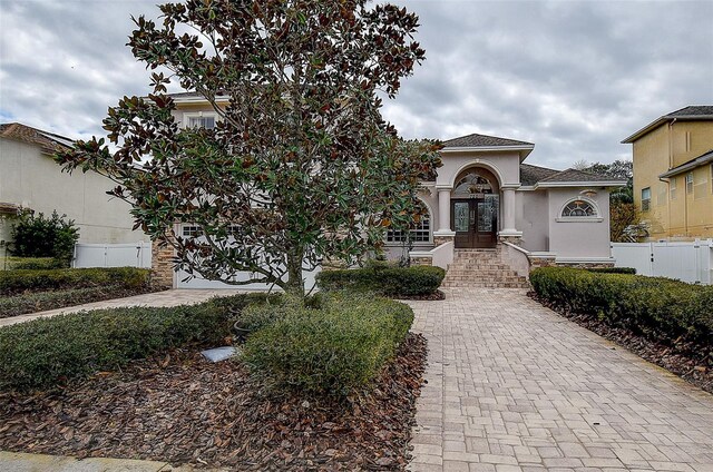 mediterranean / spanish-style home featuring french doors