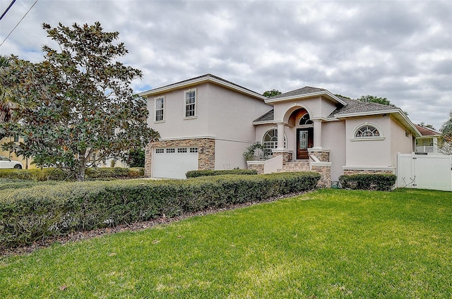 view of front facade with a front yard and a garage