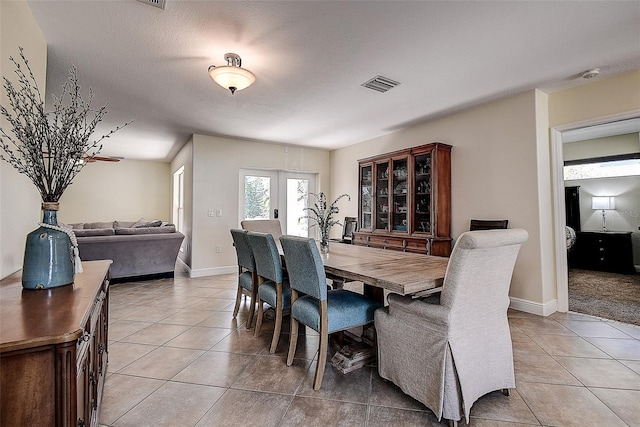 tiled dining area with french doors