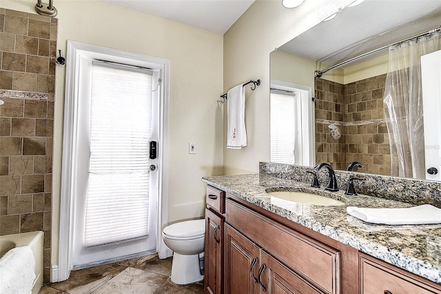 full bathroom with toilet, vanity, and shower / bath combination with curtain