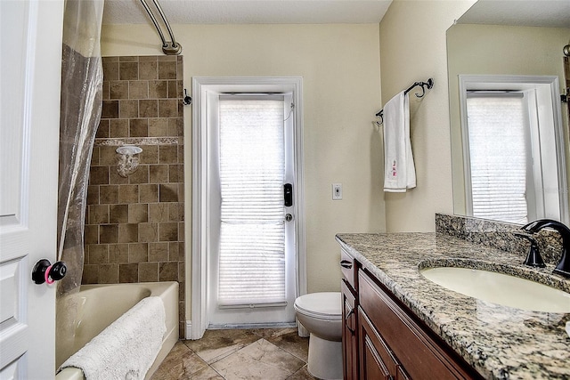 full bathroom with shower / bath combo with shower curtain, toilet, vanity, and a healthy amount of sunlight