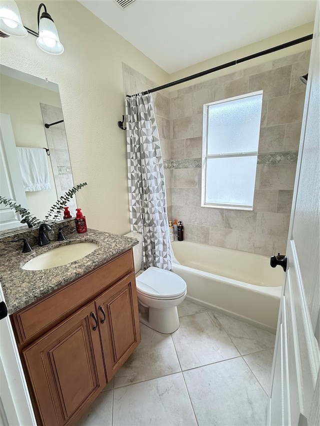 full bathroom with shower / bath combo with shower curtain, toilet, and vanity