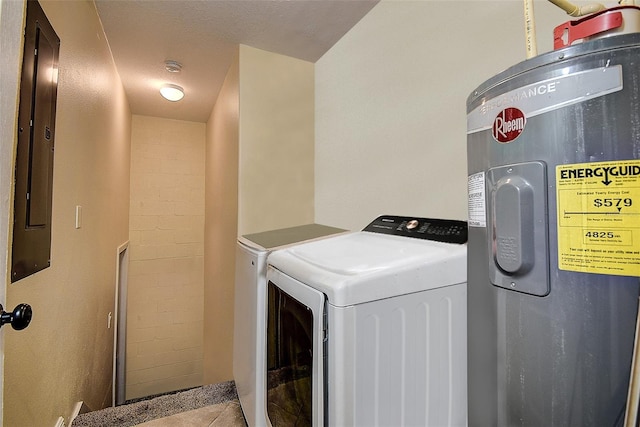 laundry area featuring washer and dryer, light tile patterned floors, electric panel, and water heater