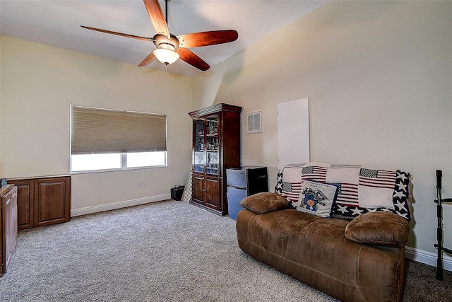 living room featuring ceiling fan and light colored carpet