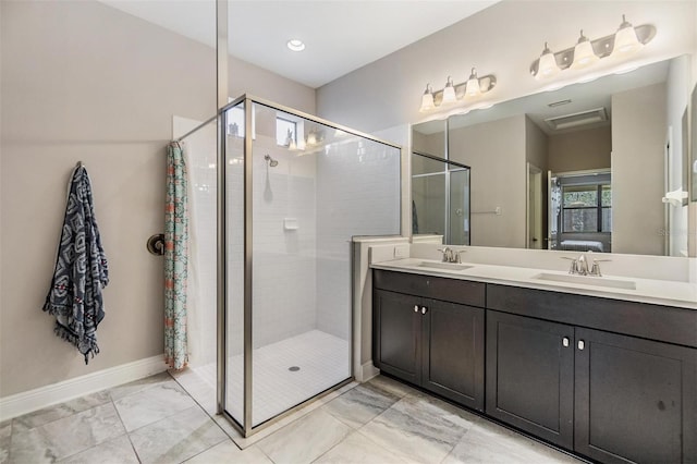 bathroom featuring vanity and tiled shower