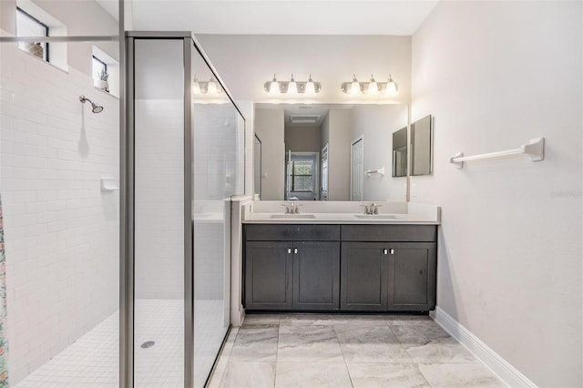 bathroom with walk in shower, plenty of natural light, and vanity