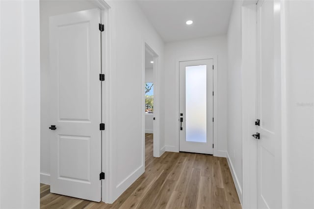 entryway with light hardwood / wood-style flooring