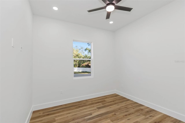 spare room featuring ceiling fan and hardwood / wood-style flooring