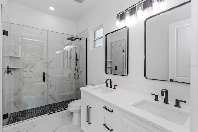 bathroom featuring toilet, an enclosed shower, and vanity