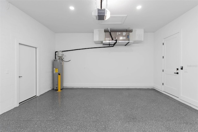 garage featuring electric water heater and a garage door opener