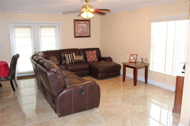 living room featuring ornamental molding, ceiling fan, and french doors