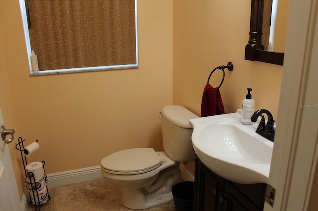 bathroom with toilet and vanity