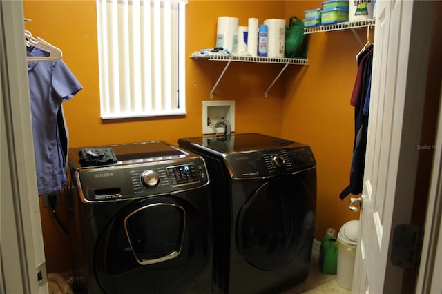 washroom featuring washer and dryer