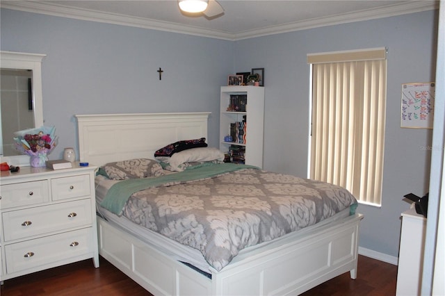 bedroom featuring ceiling fan, ornamental molding, and dark hardwood / wood-style floors