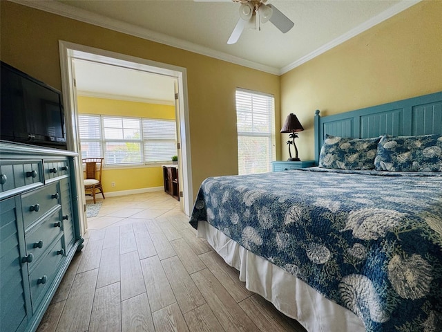 bedroom featuring ceiling fan, crown molding, baseboards, and wood finished floors