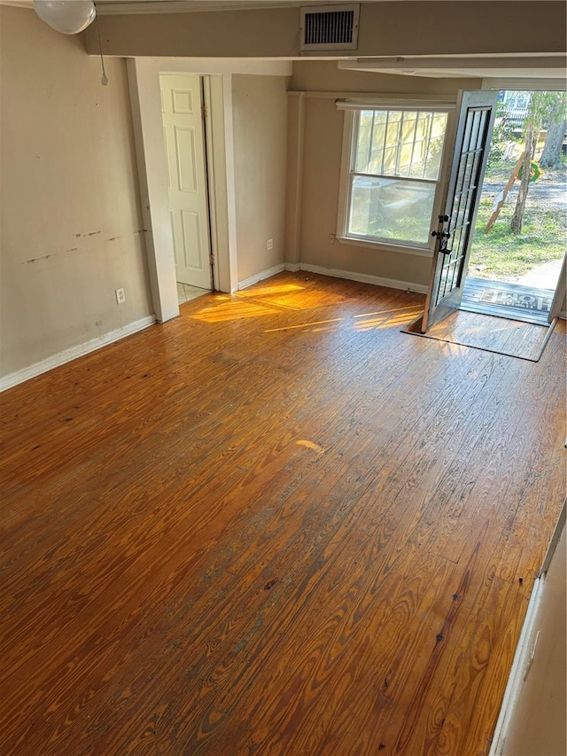 unfurnished room featuring hardwood / wood-style flooring