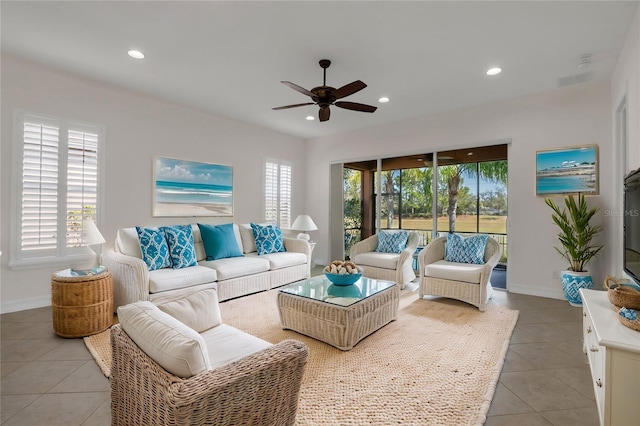 living room featuring ceiling fan and light tile patterned floors